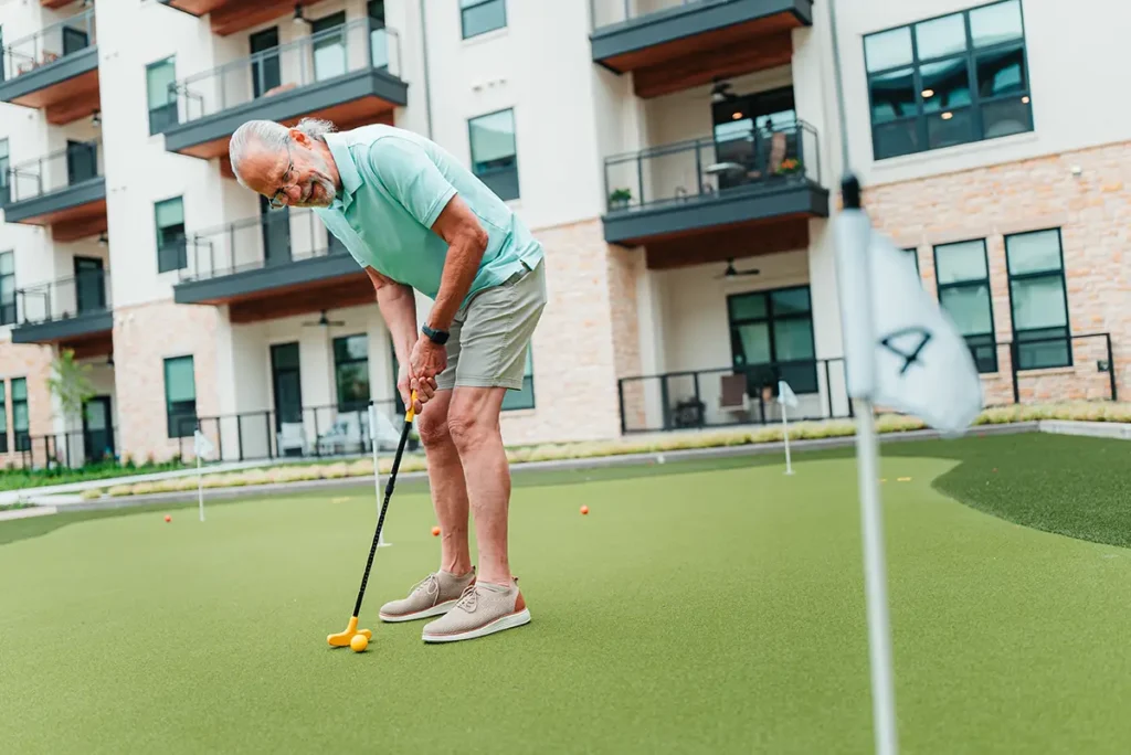 A senior an on a putting green